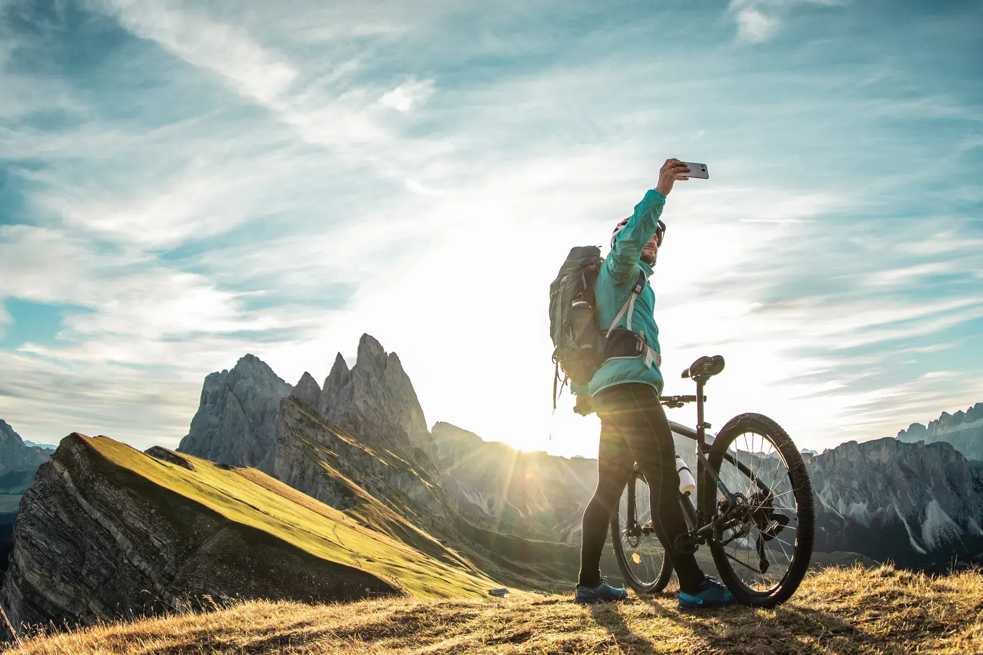 Cyclist overlooking a mountain lake