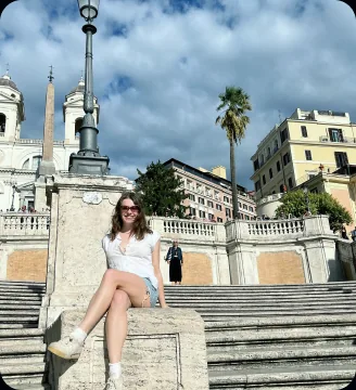 Traveler sitting on the Spanish Steps in Rome